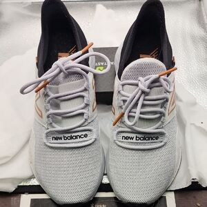 New Balance White and Black Sneakers with Orange Accents